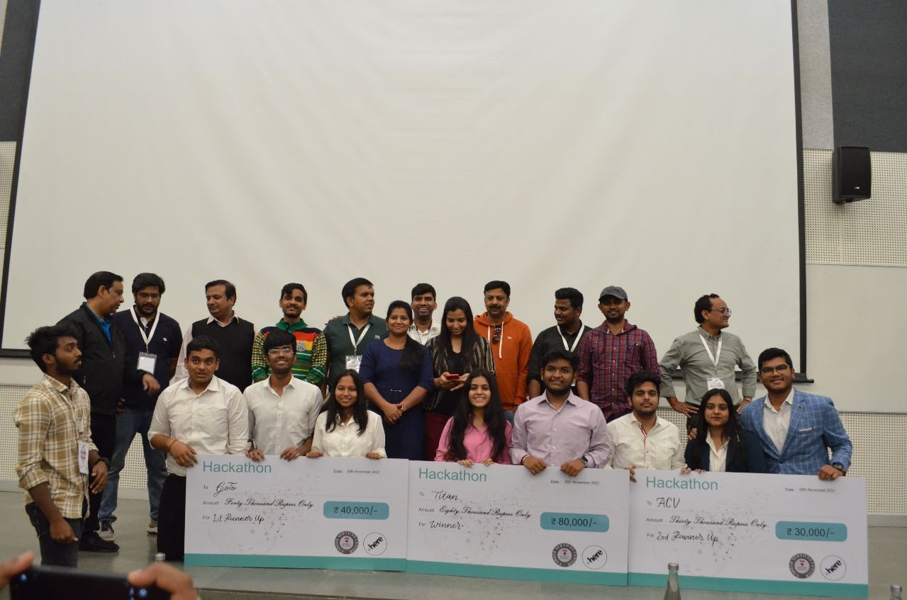 Group photo of hackathon award recipients and presenters.